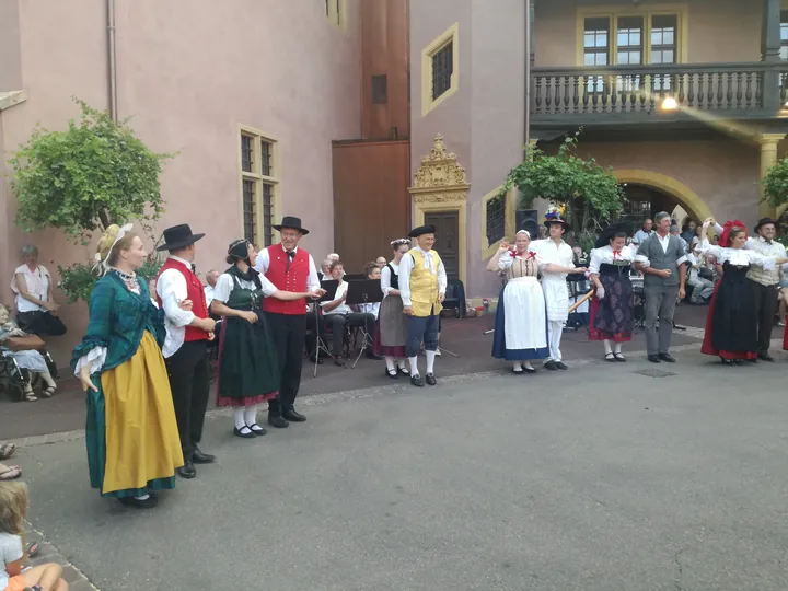 Folklore dancing in the evening at Colmar, Alsace (France)